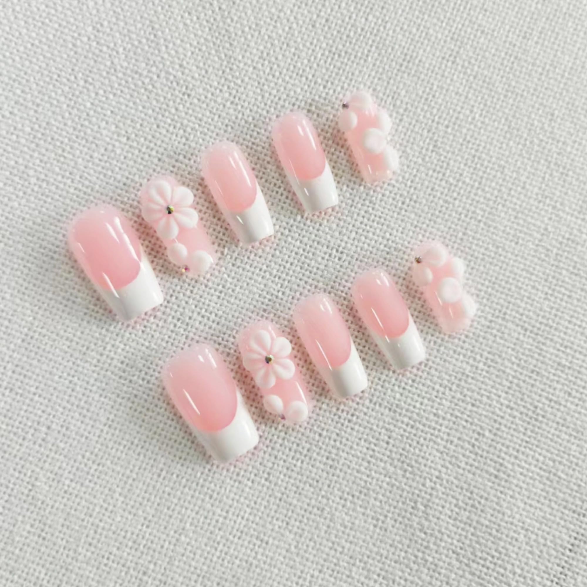 Qicaijia rhinestone-embellished nails add subtle sparkle for special occasions.