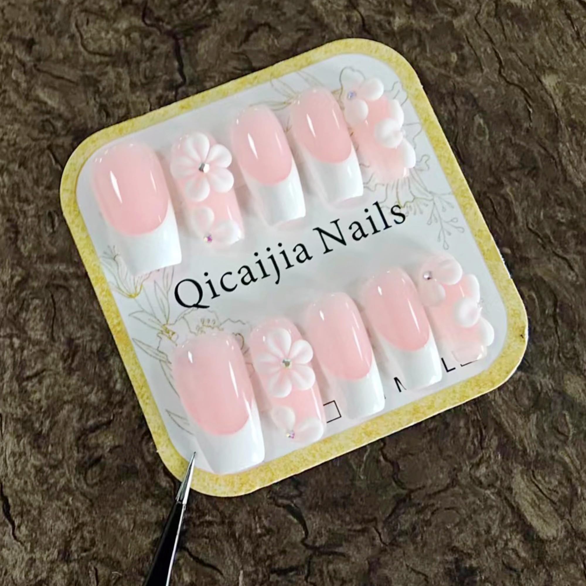 Qicaijia white French tip nails with pink accents for at-home manicure.