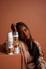 QoD Pro Argan oil serum bottle close-up with emphasis on fast absorption and shine.