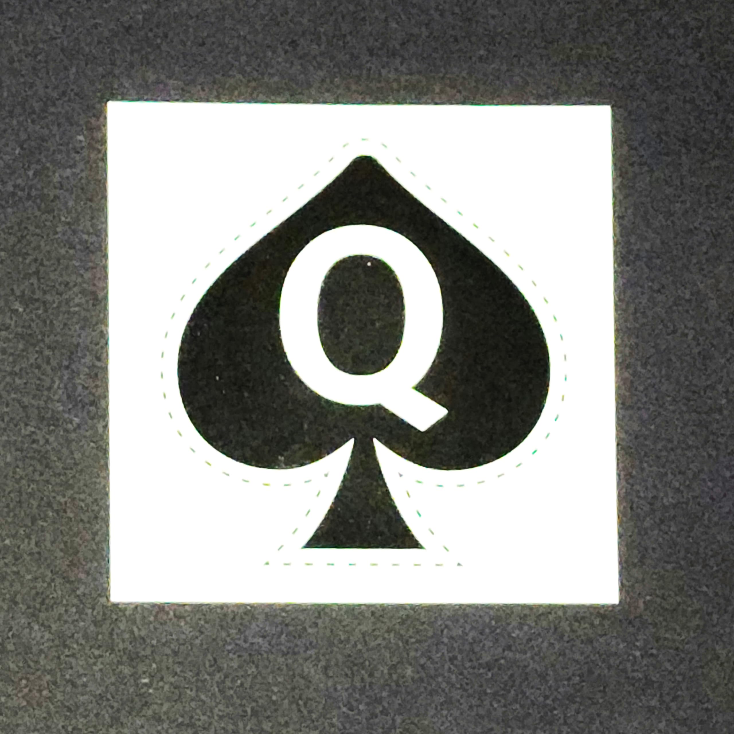 Queen of Spades tattoo on forearm display, visible art for events