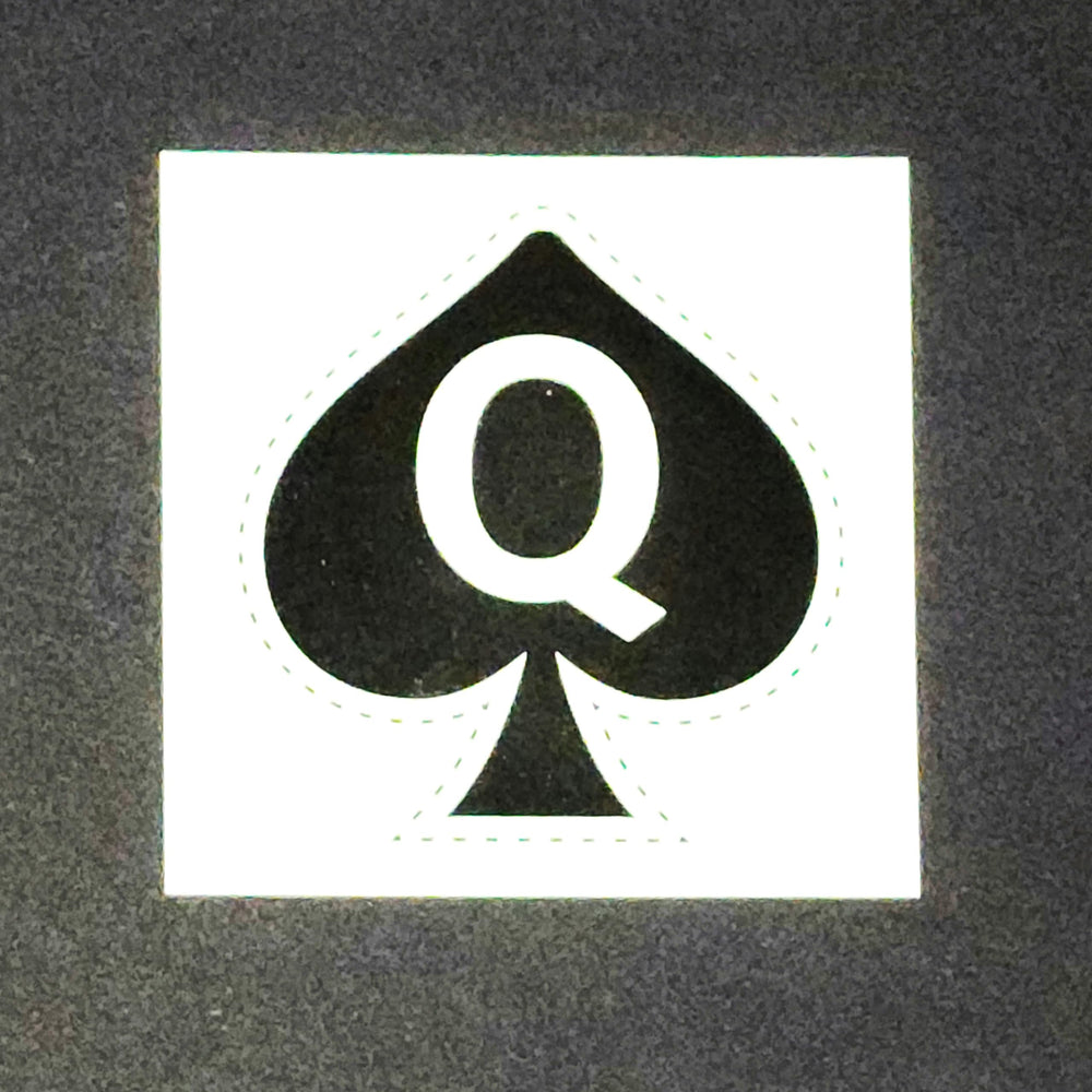 Queen of Spades tattoo on forearm display, visible art for events