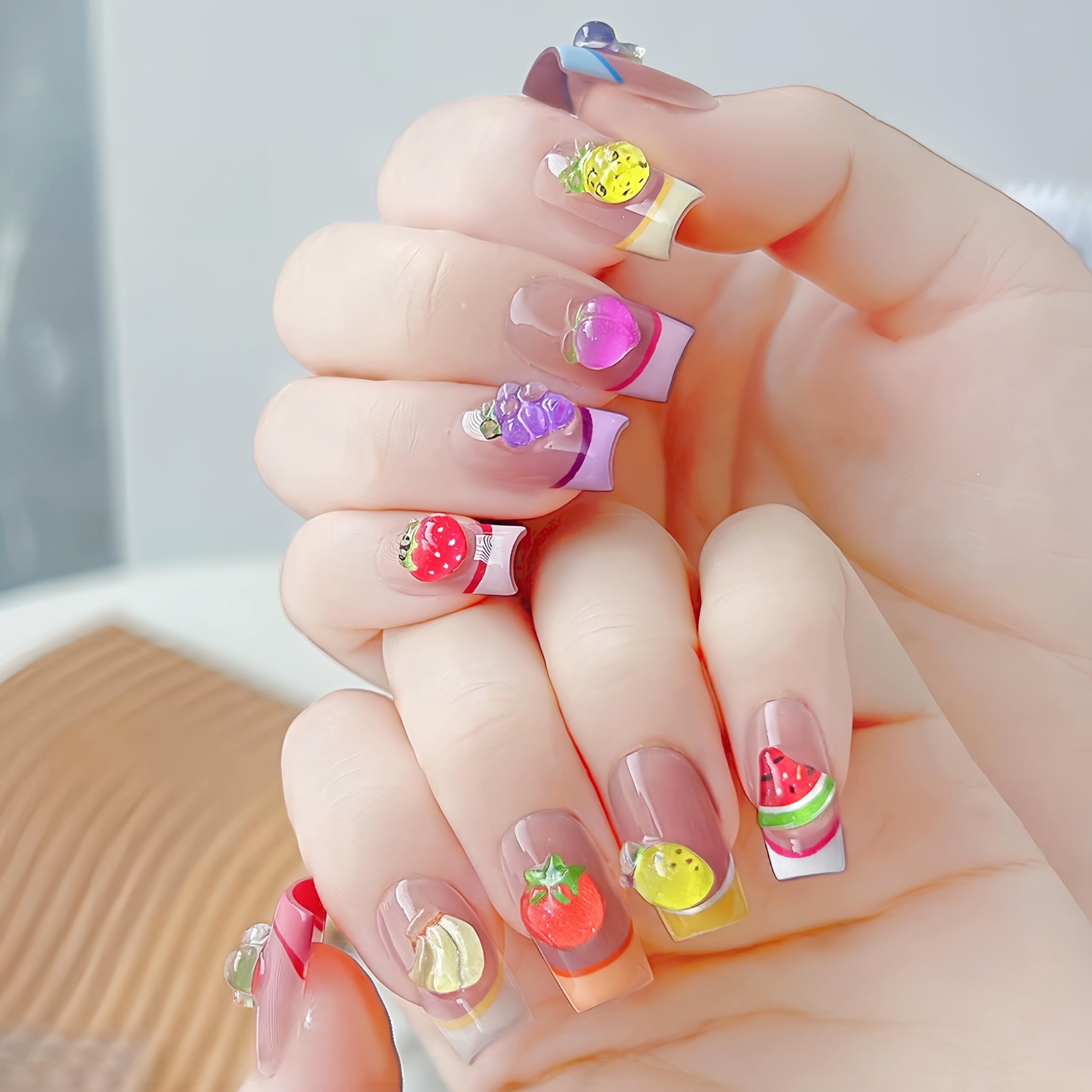 Quezadyl 3D colorful-fruit charms bring eye-catching texture to acrylic nails.