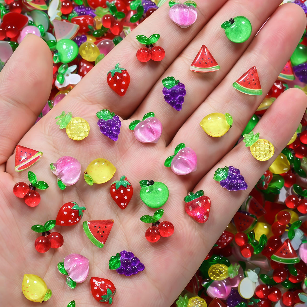 Quezadyl 3D strawberry nail charms add cute sparkle for DIY manicures.