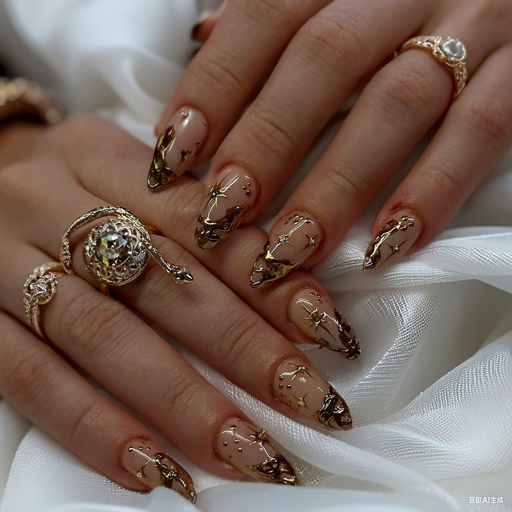 QZRUO Nails featuring 3D gold chrome detail for a bold shimmer.