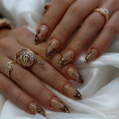 QZRUO Nails featuring 3D gold chrome detail for a bold shimmer.