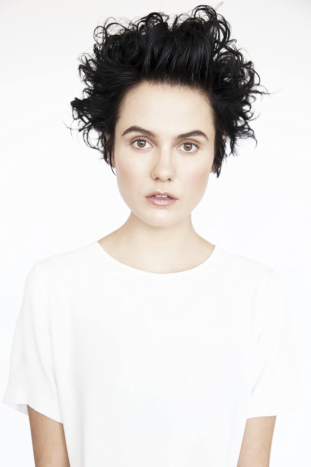R+CO Aircraft Pomade Mousse applied to damp hair enhances volume and bounce.
