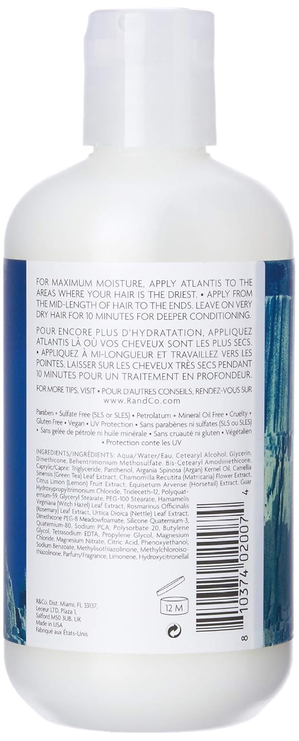 Hands applying Atlantis conditioner showing smooth texture for even distribution