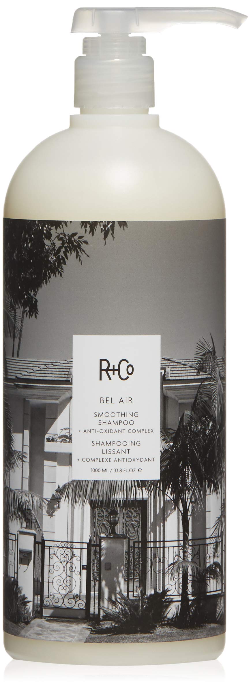 R+Co Bel Air smoothing shampoo bottle for a luxe cleansing experience and silky hair.