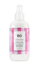 R+Co Candy Stripe Protect + Prep Detangling Spray bottle-dispense for quick detangling.