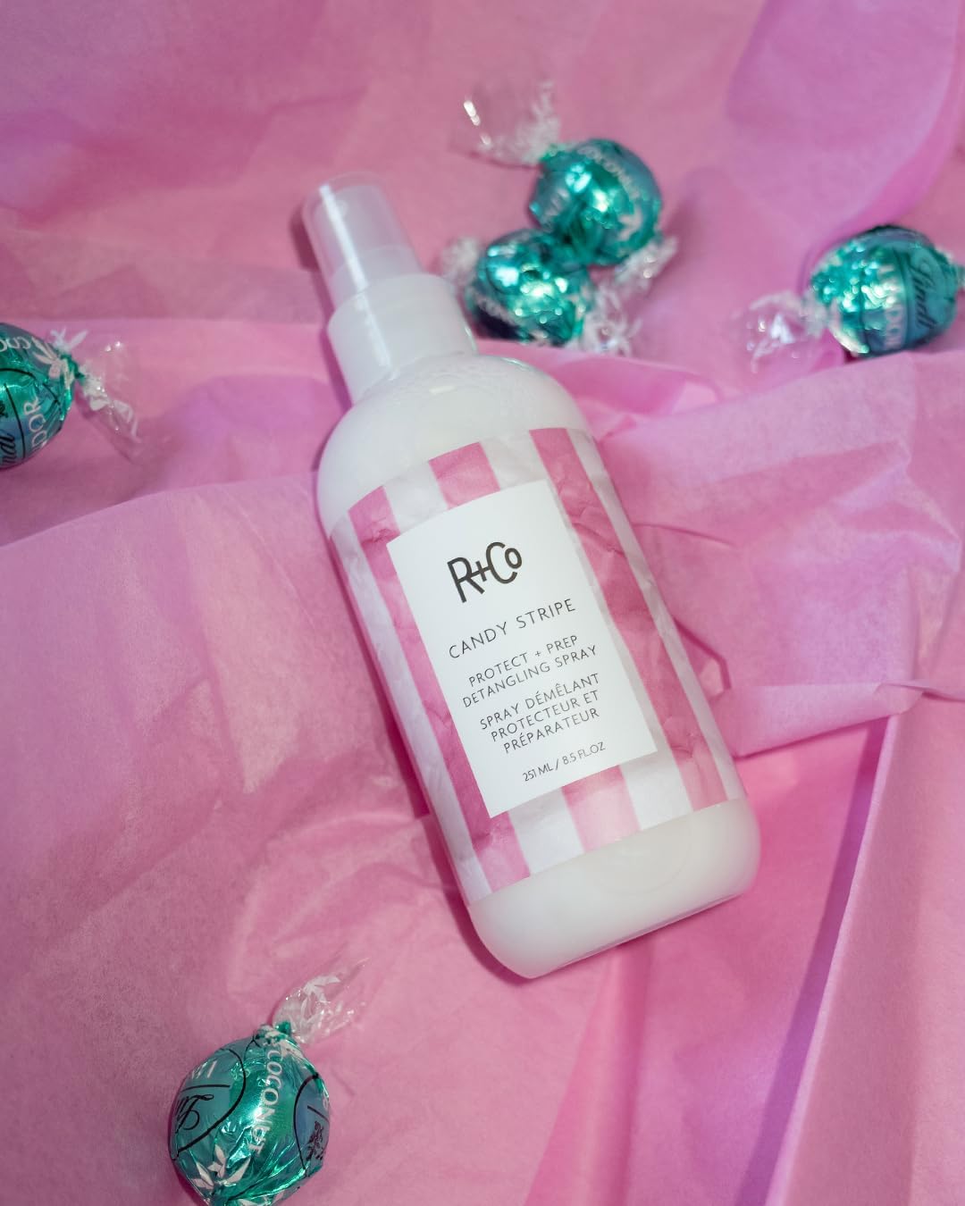 R+Co Candy Stripe seals cuticle for shine and frizz control.