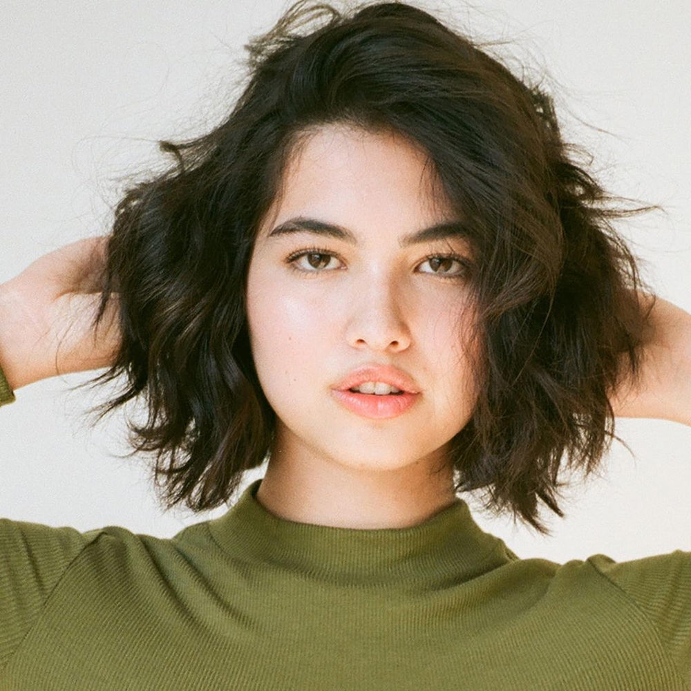 R+Co Cool Wind pH formula close-up highlights frizz taming capability.