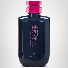 Closeup of the R+Co Soft Bounce label highlighting hydration benefits for curls.