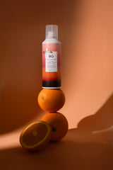 R+Co SUN CATCHER spray mist delivering lightweight hydration and frizz control.
