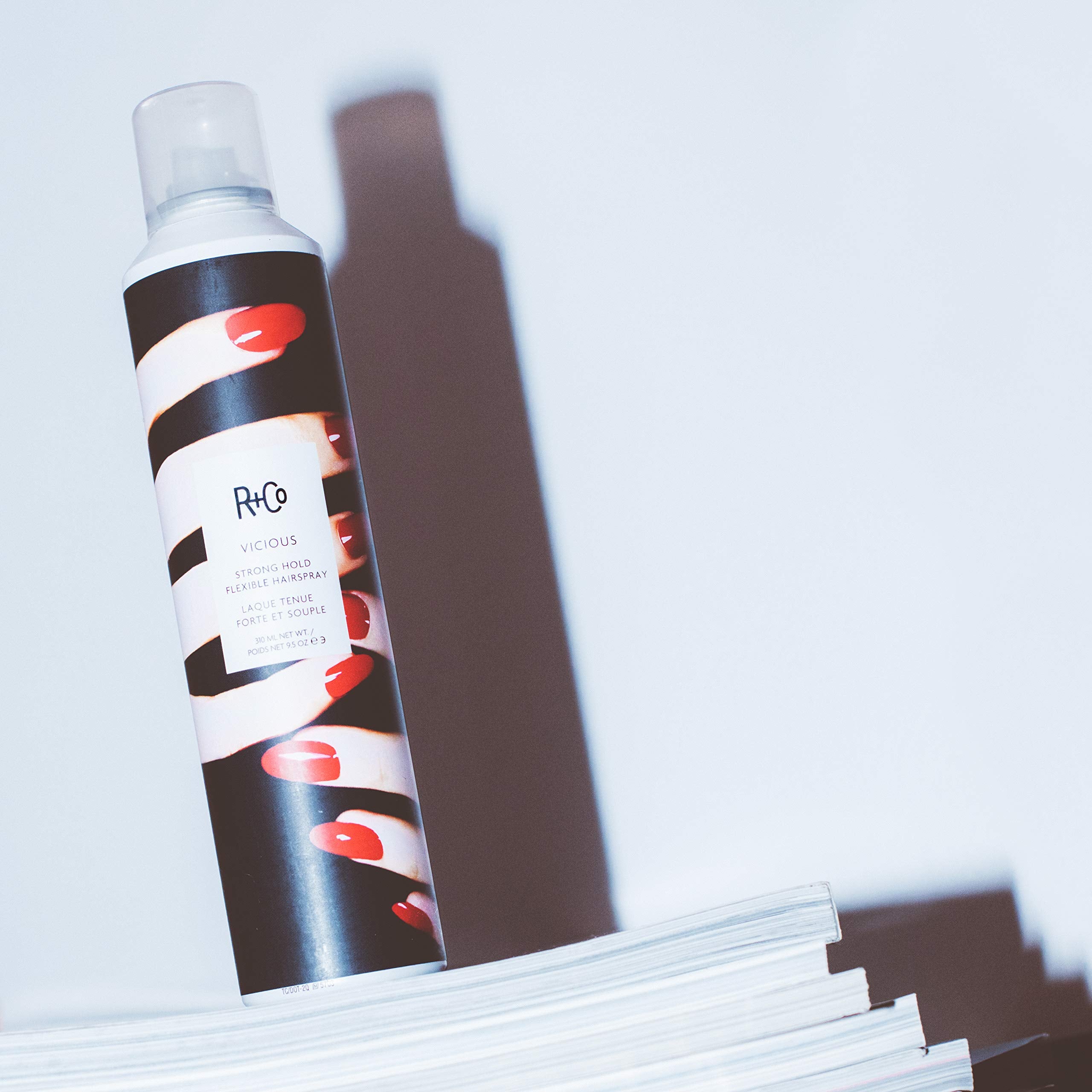 Applying VICIOUS to dry hair to secure shape for daily use