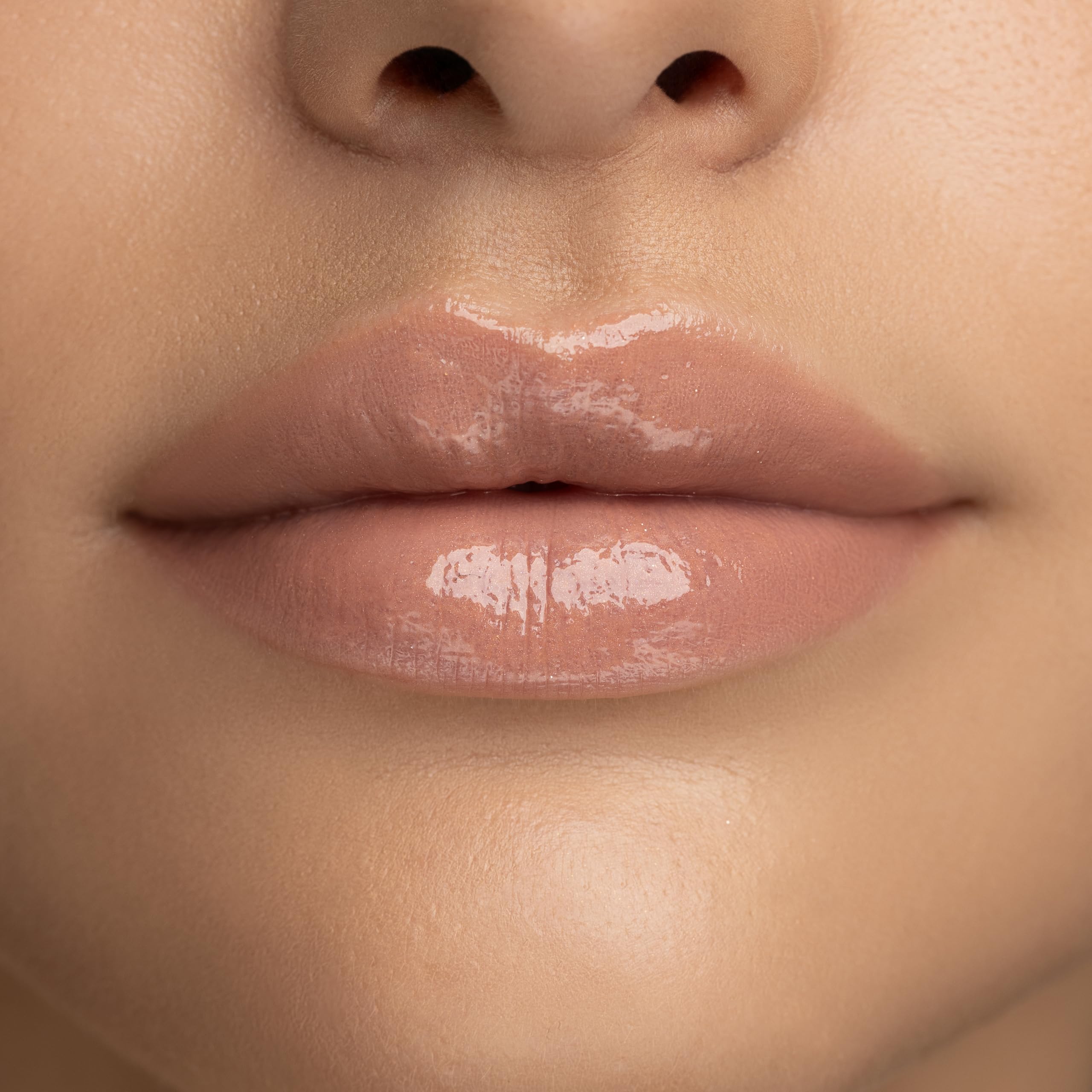 Radiant Professional Lip Glaze applicator demonstrates smooth, even application