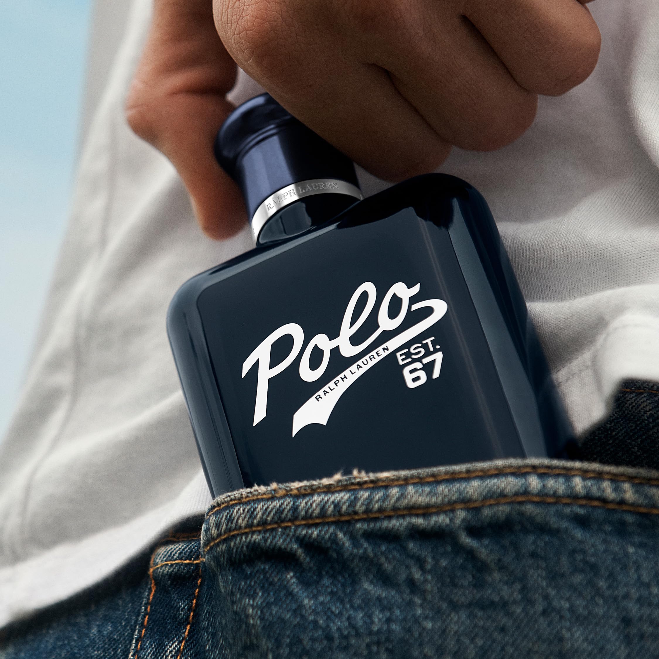 Ralph Lauren Polo 67 bottle on a wooden surface with natural light.