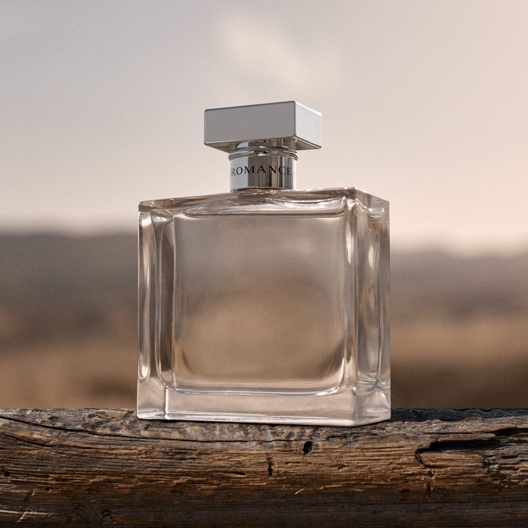 Ralph Lauren Romance bottle on skin conveys smooth, lasting warmth.