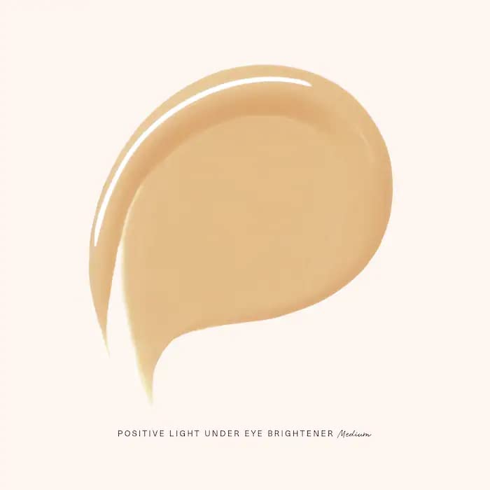 Rare Beauty Crème éclairante contour des yeux, application douce pour un regard plus frais.