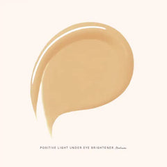 Rare Beauty Crème éclairante contour des yeux, application douce pour un regard plus frais.