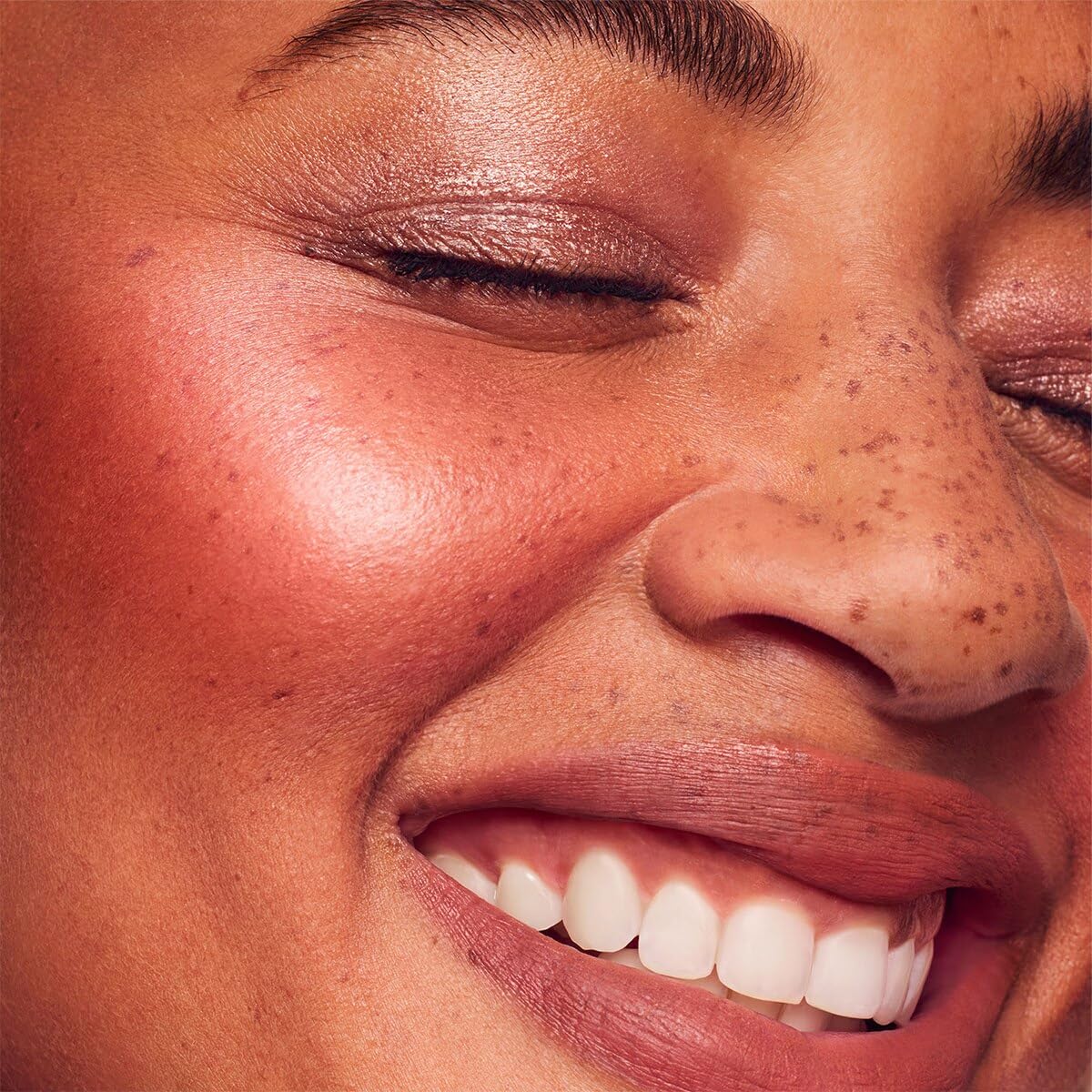 Rare Beauty glow application demo showing buildable dew on cheeks.