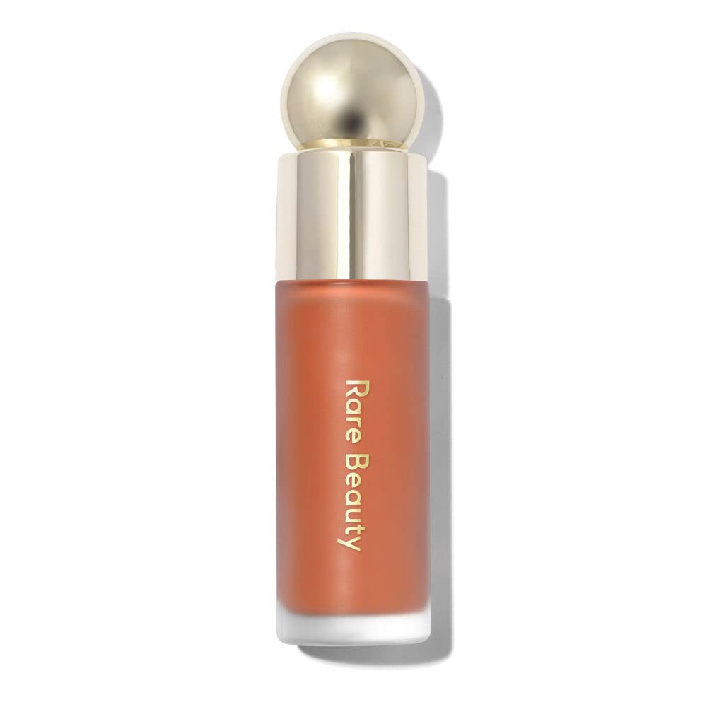 Rare Beauty Soft Pinch Joy bottle close-up for weightless, long-lasting color.