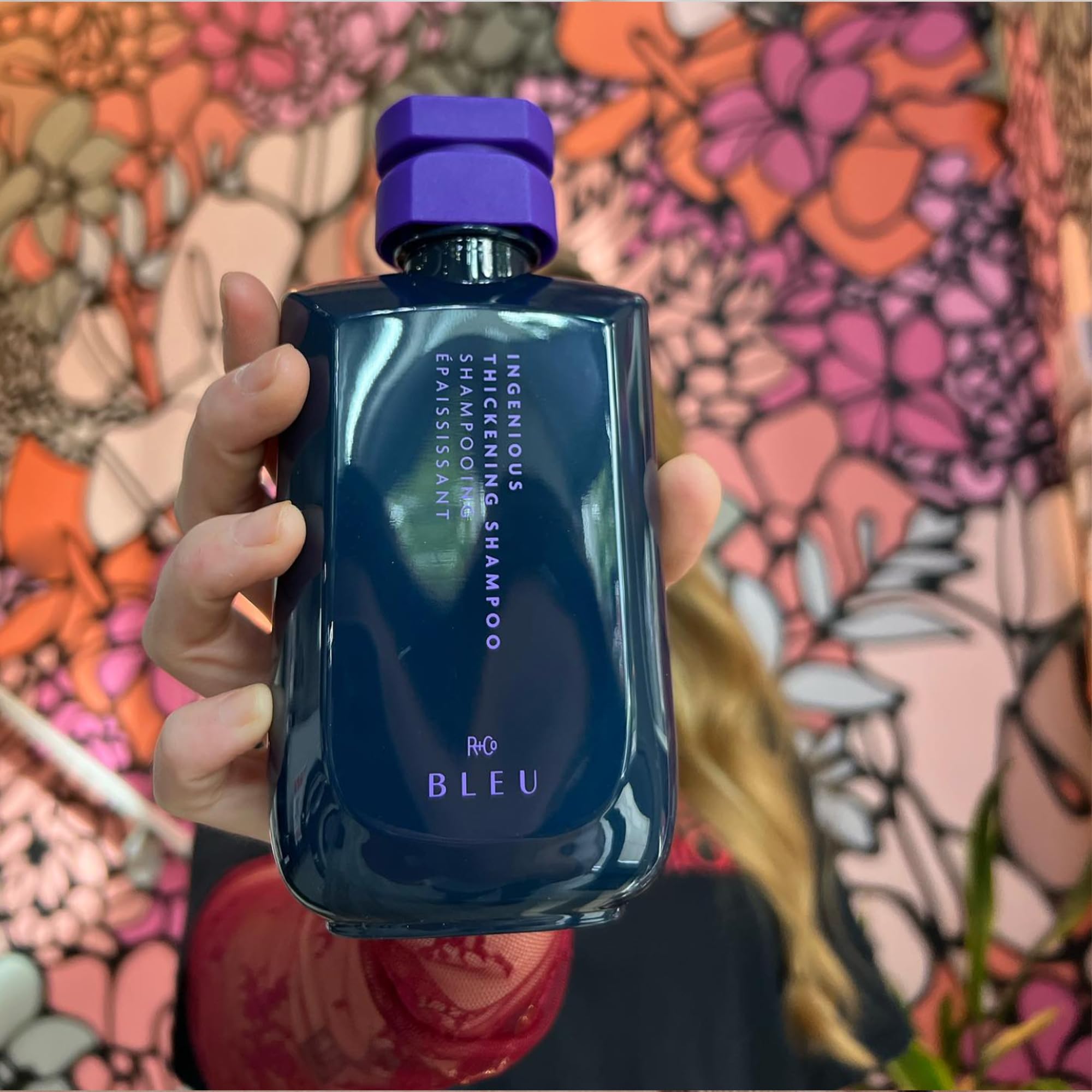 R+Co BLEU shine reflection displays glossy finish on hair.