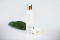 Redavid Orchid Oil Shampoo lather and pour demonstrating gentle cleansing and hydration