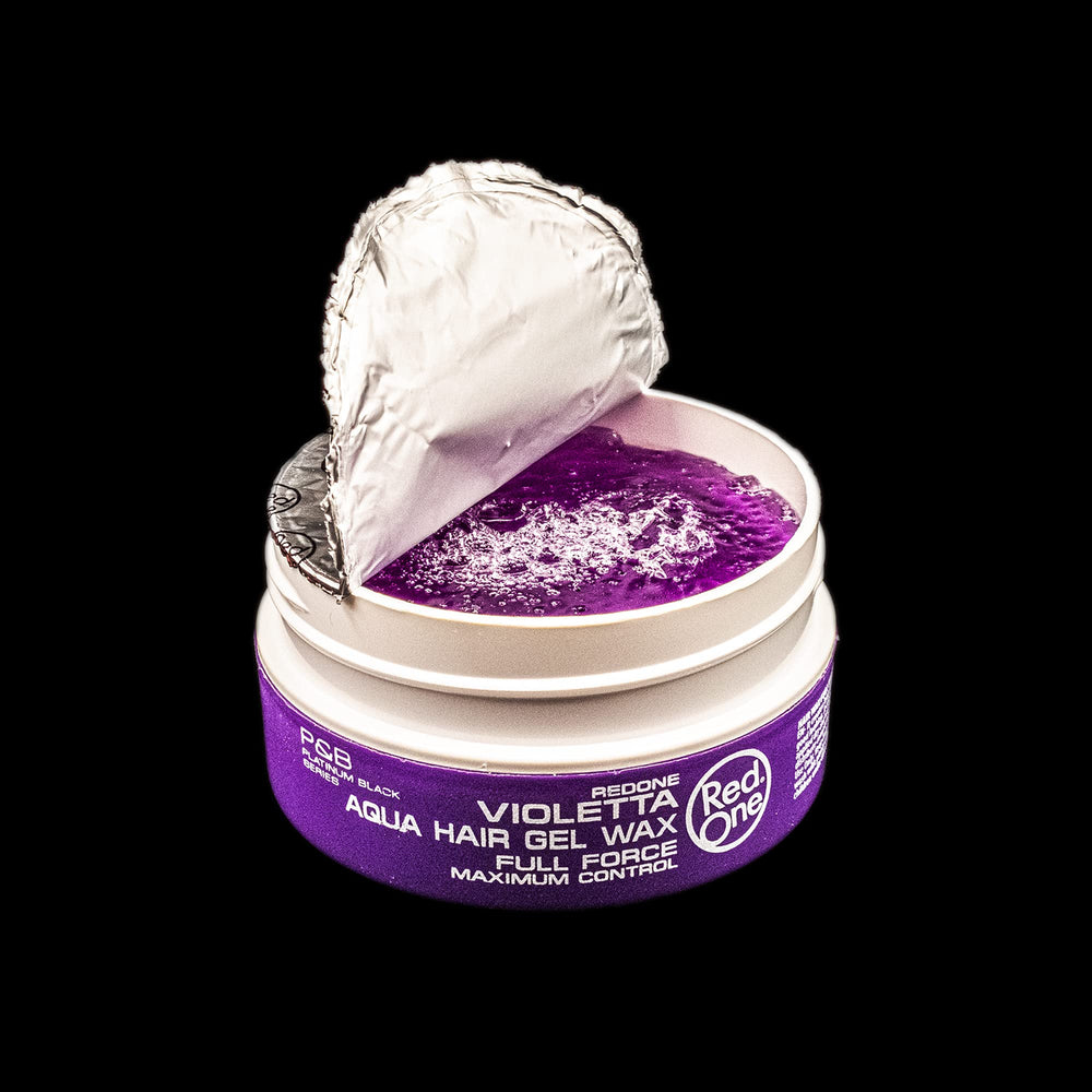 Hand applying RedOne Aqua Hair Wax to style hair with control