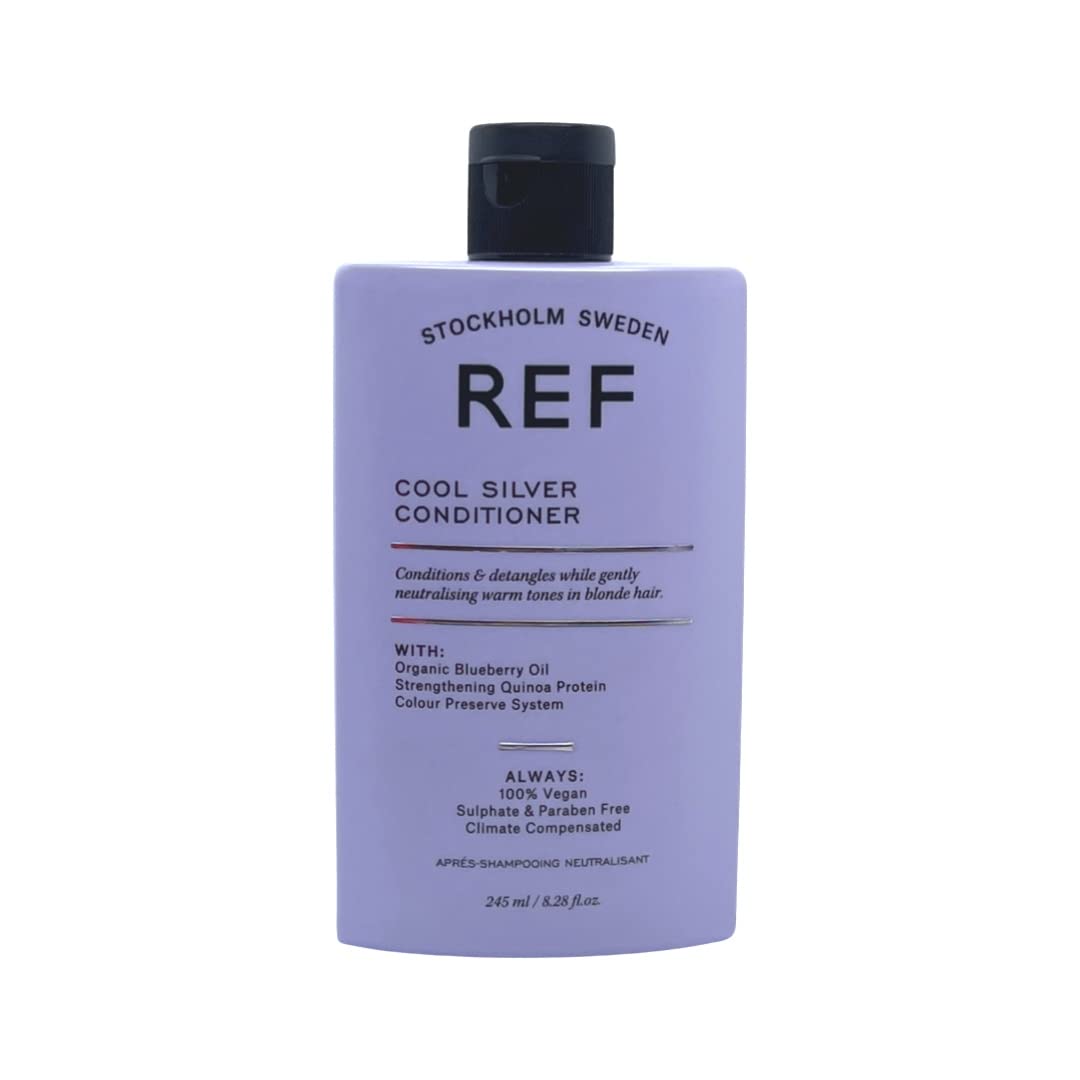 REF Cool Silver Conditioner bottle pour showing violet pigments to neutralize yellow tones.