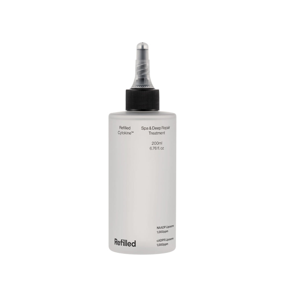 Refilled Cytokine Spa bottle close-up delivering deep hydration for stressed hair