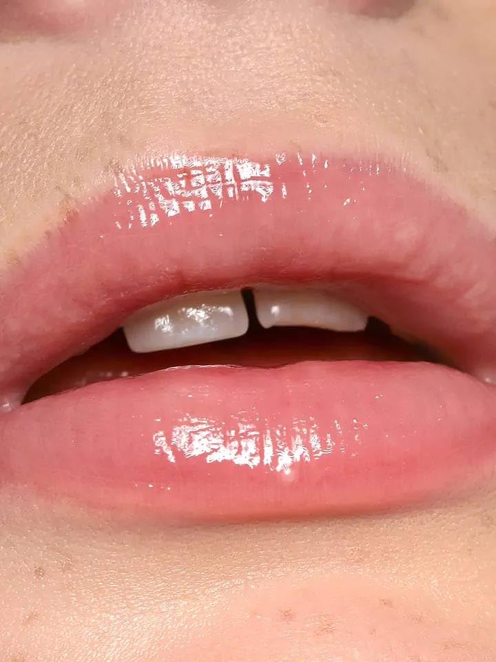 REFY Blush Lip Gloss swatch displaying light neutral pink and non-sticky comfort