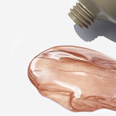 REFY Body Glow Highlighting Serum swatch in gold pink tones.