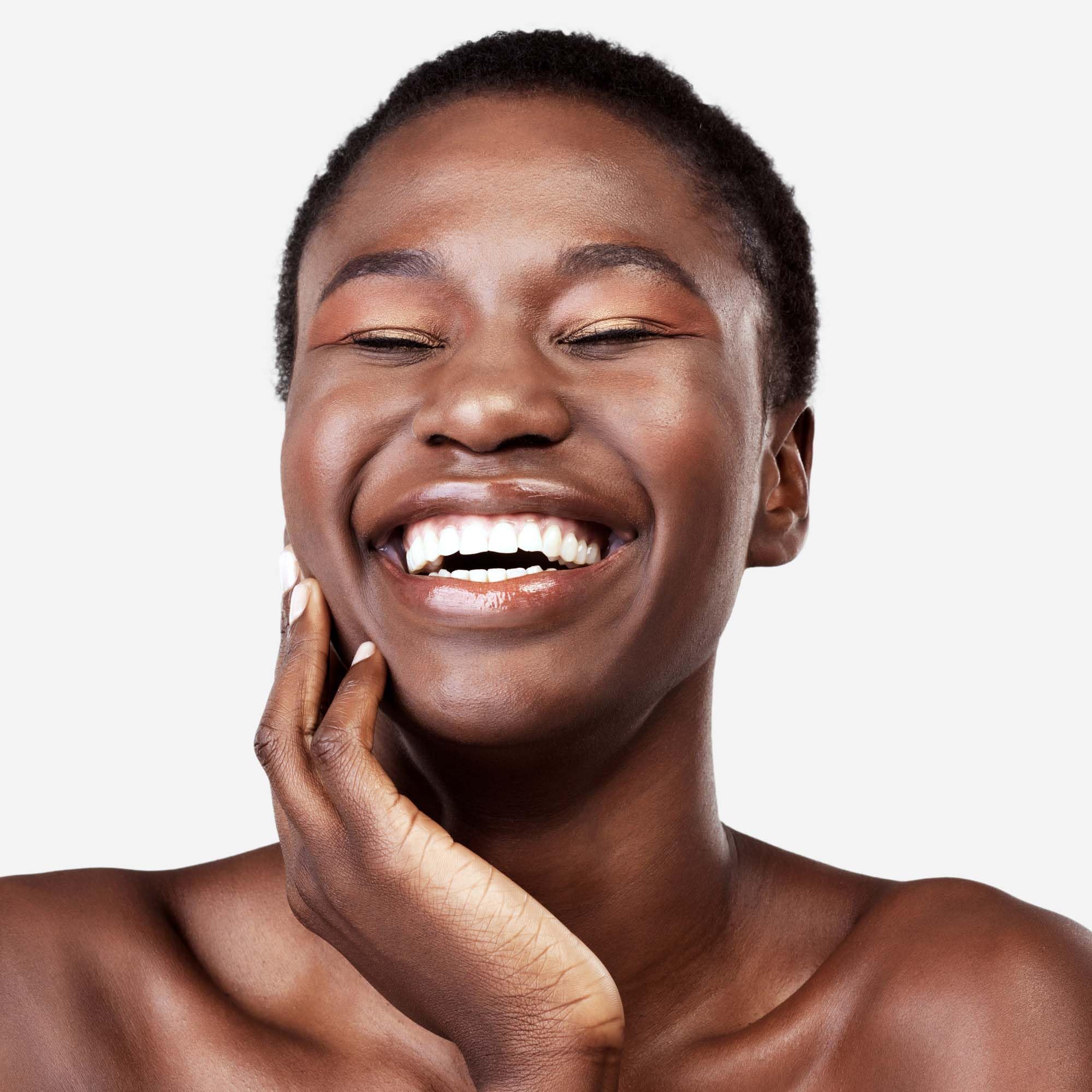 Applying Replenix Retinol 5X serum to the face for smoother skin.