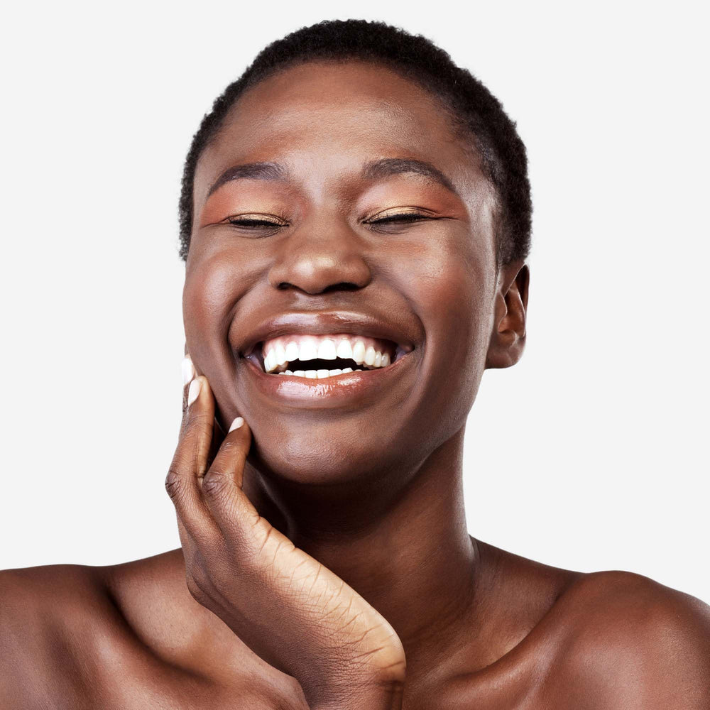 Applying Replenix Retinol 5X serum to the face for smoother skin.