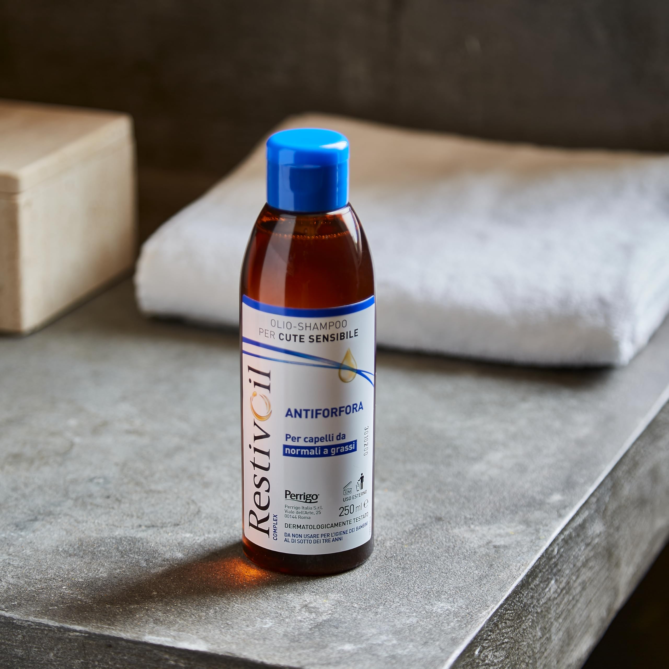 RestivOil hair care product demonstrates versatile use in a bathroom.