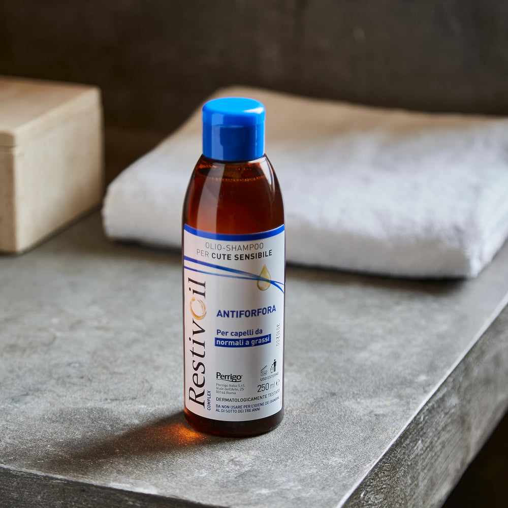 RestivOil hair care product demonstrates versatile use in a bathroom.
