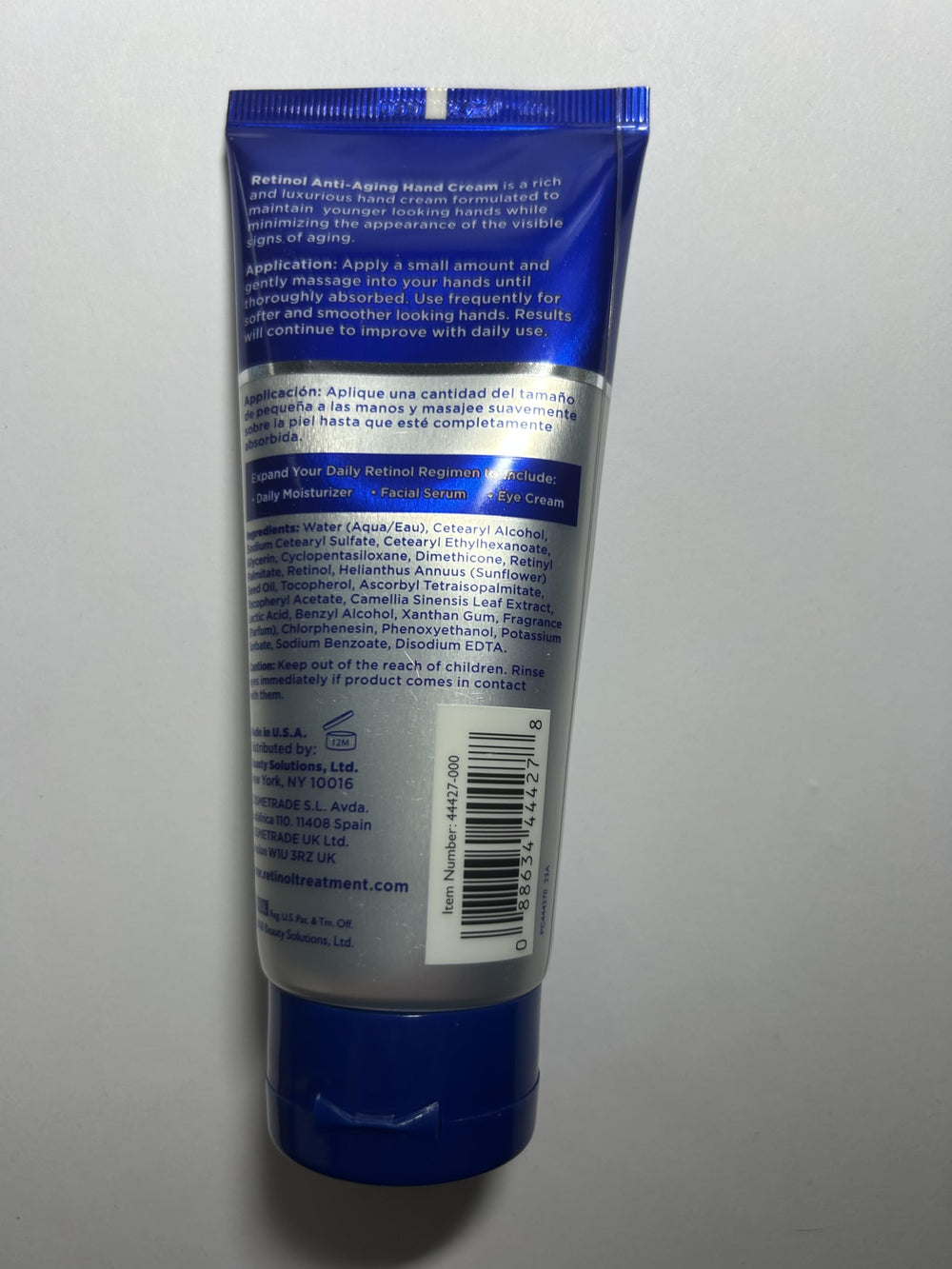 Applying Retinol Men hand cream to soothe and moisturize dry knuckles.