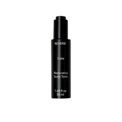 REVERIE Cake Restorative Scalp Tonic bottle pour showing soothing hydration for dry scalps
