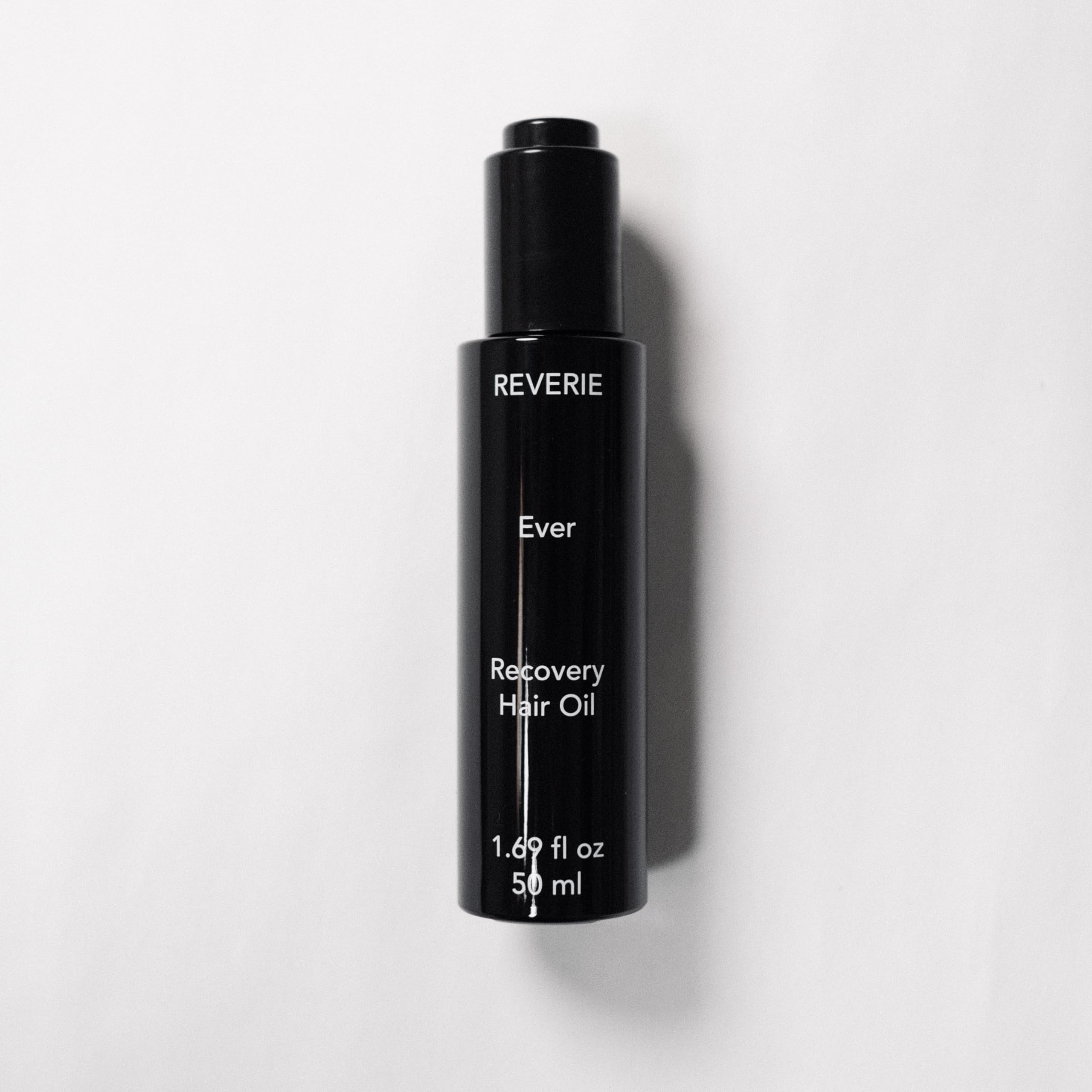 REVERIE Ever Recovery Oil bottle with routine shot for easy daily shine
