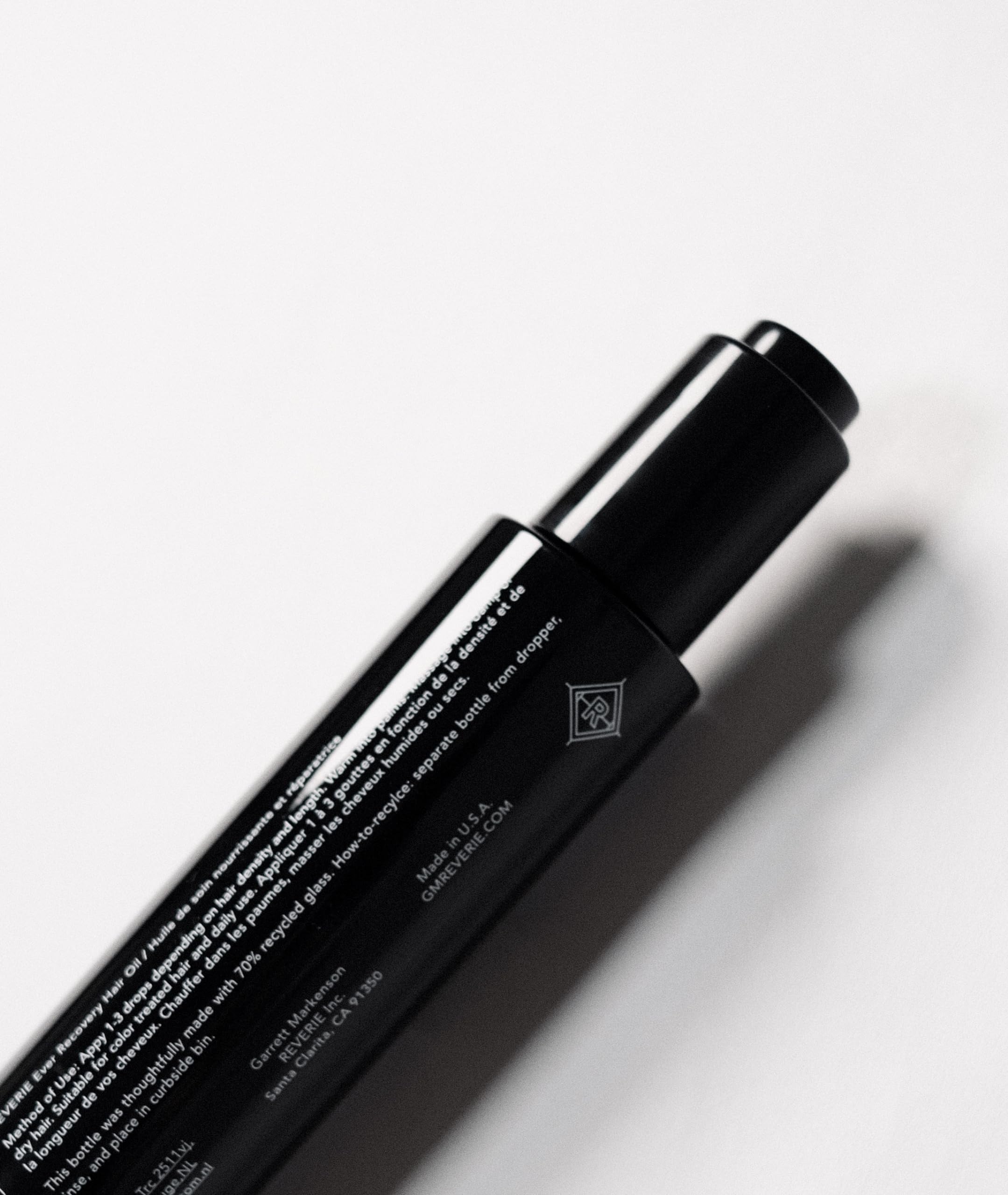 REVERIE Ever Recovery Oil on damp strands enhances elasticity and reduces breakage