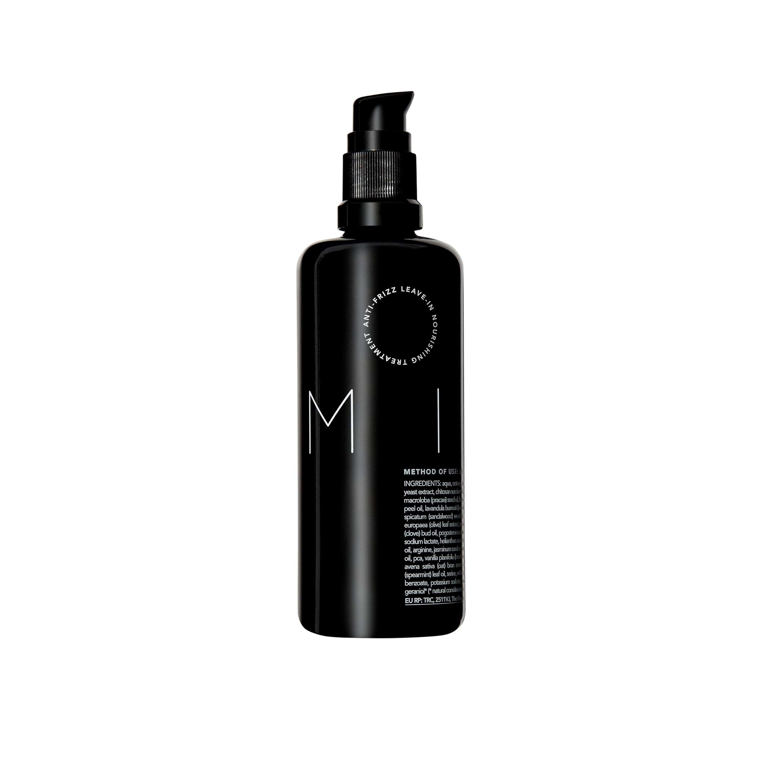REVERIE Natural Milk anti-frizz bottle closeup shows frizz control.