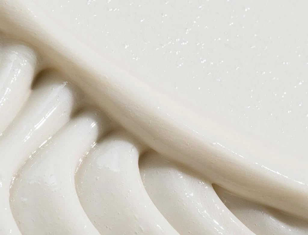 REVERIE conditioner texture close-up shows creamy consistency for detangling