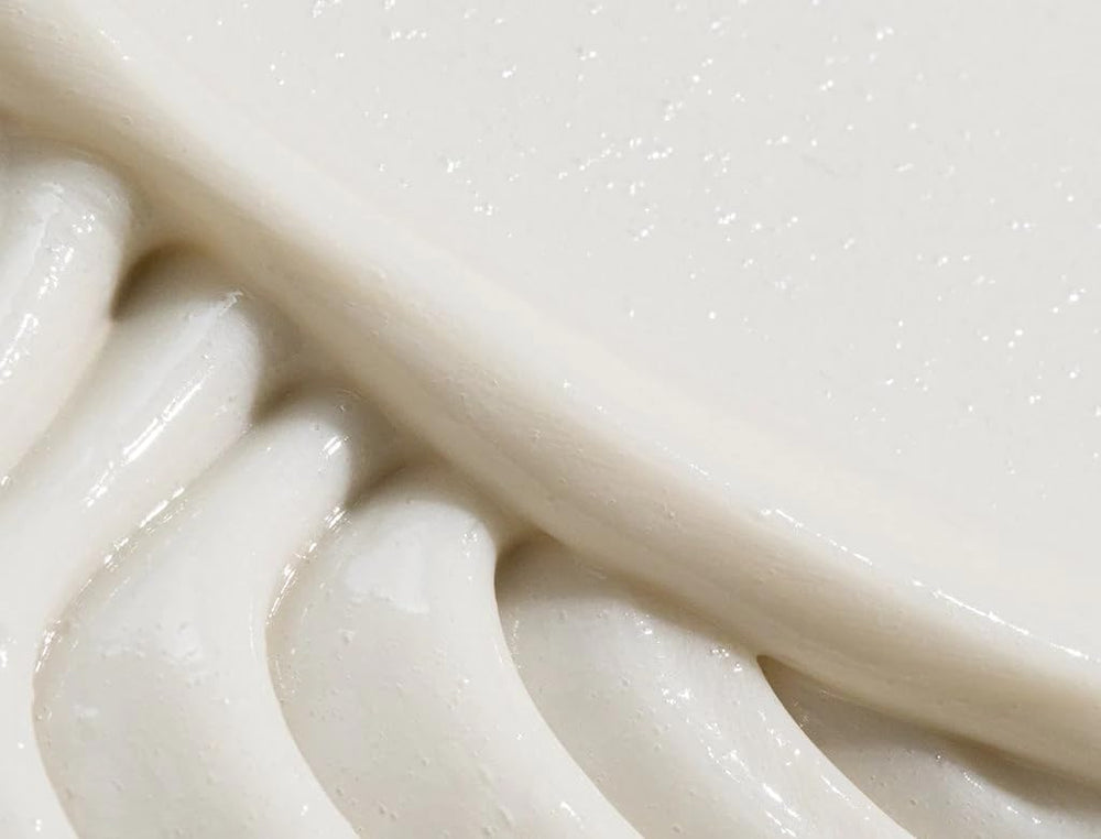 REVERIE conditioner texture close-up shows creamy consistency for detangling