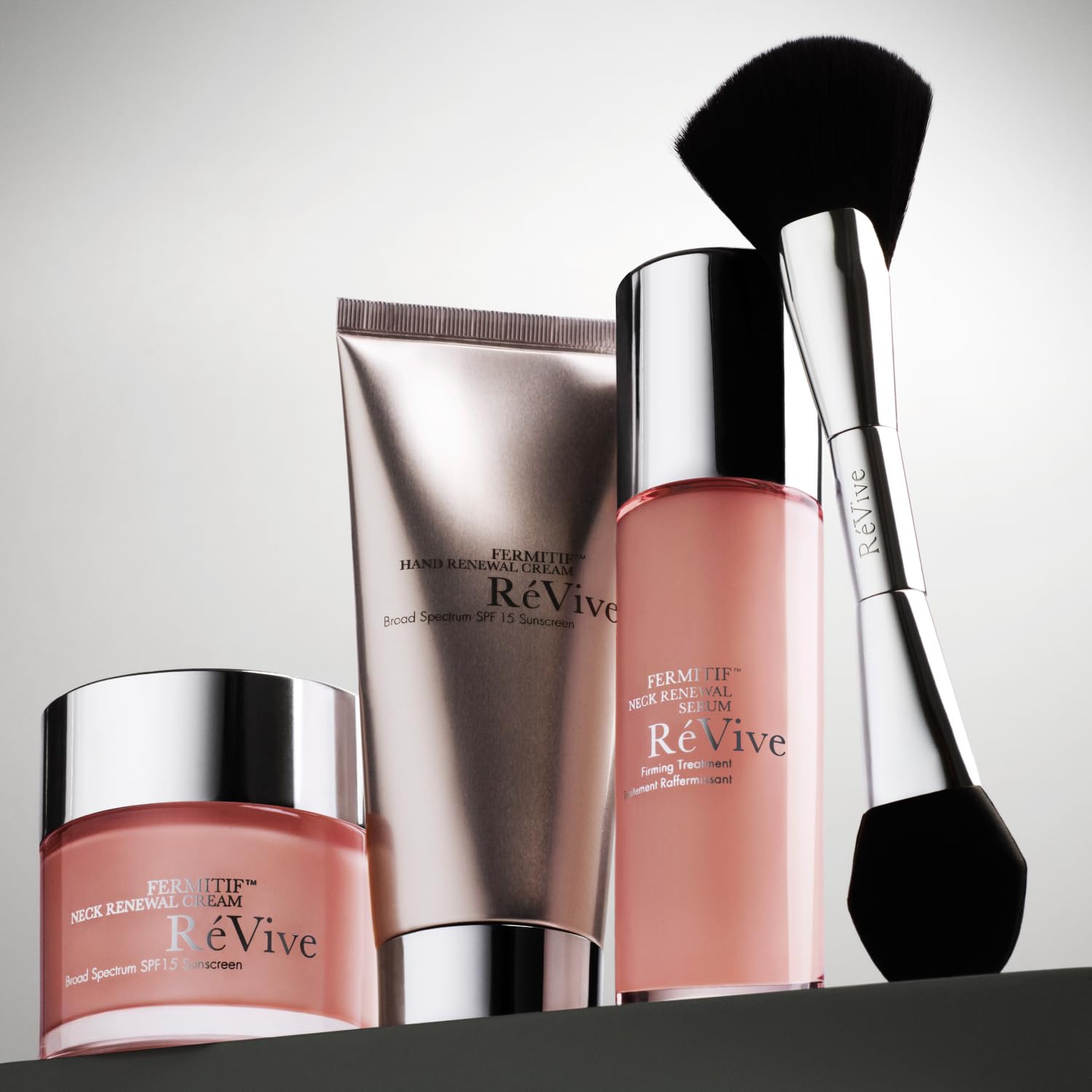 RéVive Fermitif neck serum pairs with SPF 15 cream for protection.
