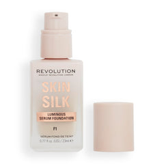 Revolution Beauty London Skin Silk Serum Foundation bottle with pump for precise application.