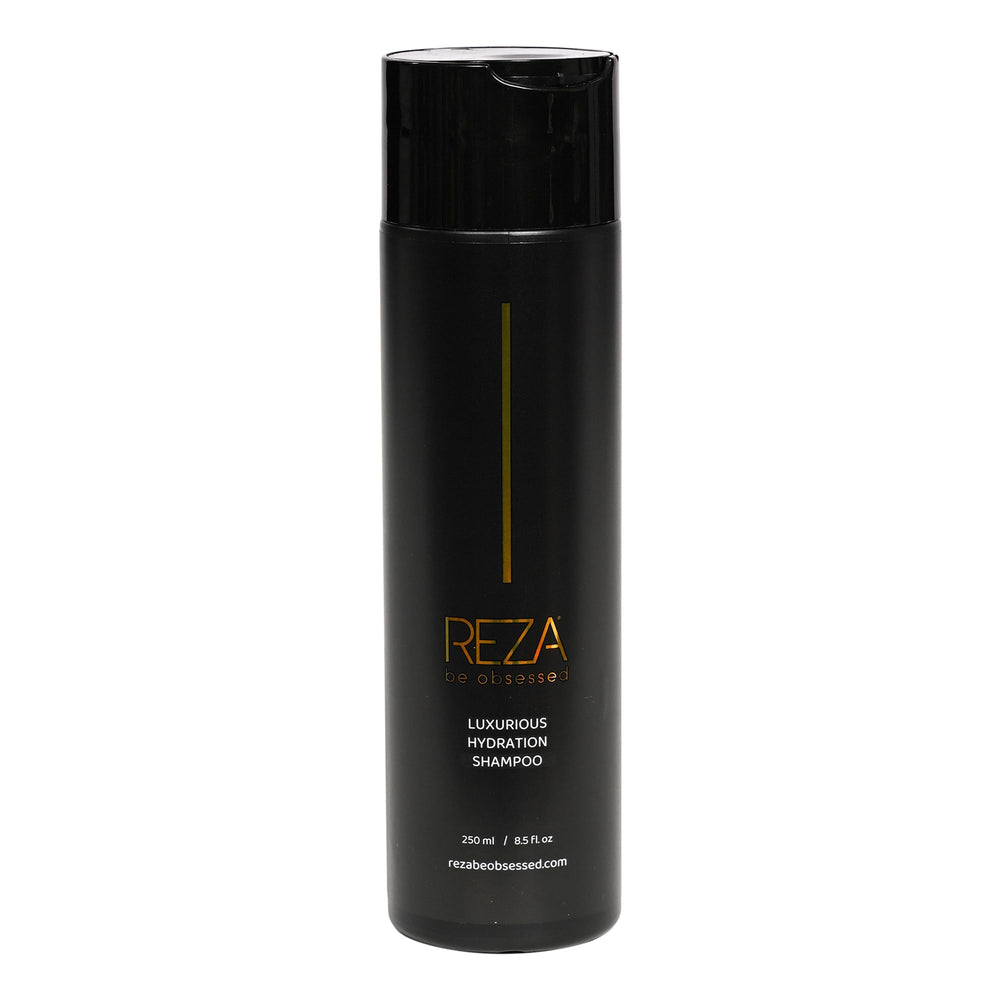 Reza Fixation Shampoo bottle with gold glow for luxurious shine.