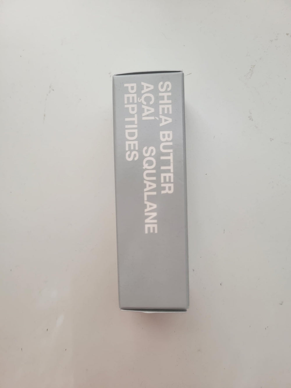 Rhode Barrier Restore Cream in hand during gentle application.