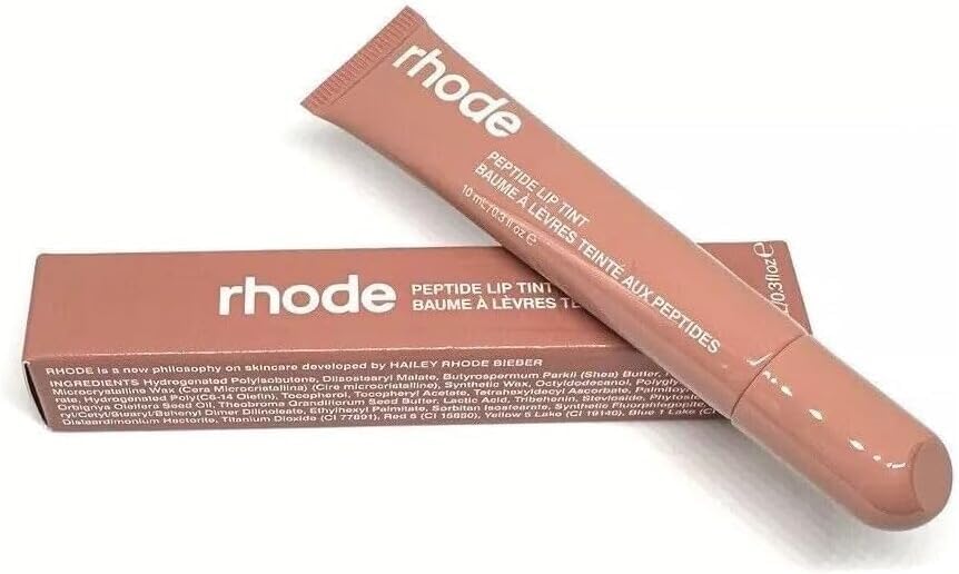 Rhode Gloss Lip Tint packaging display showing the Toast shade for on-the-go glow.