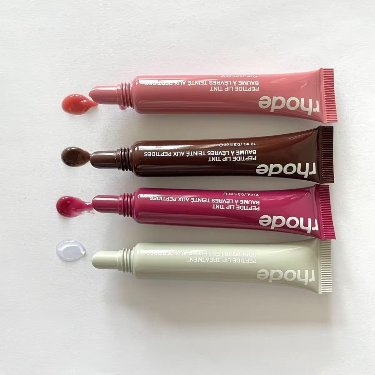 Application with Rhode Gloss Lip Tint wand demonstrating easy, precise use.