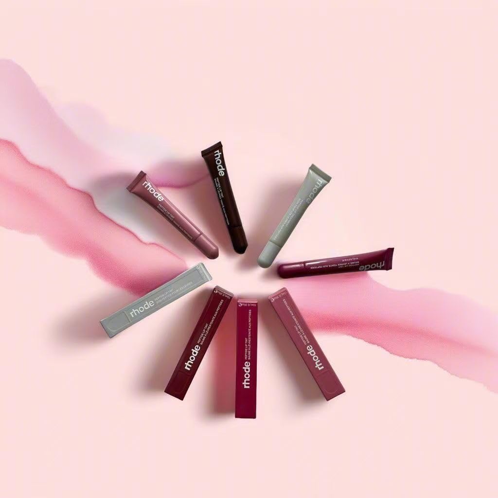 Lips wearing Rhode Gloss Lip Tint showing translucent color and natural shine.